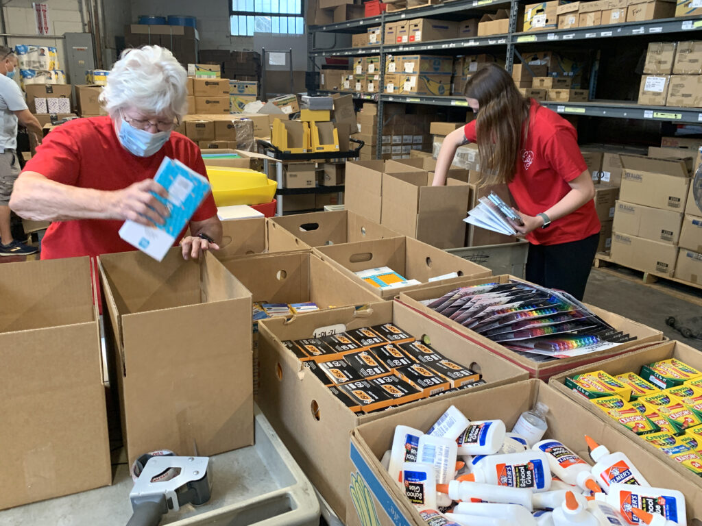 Image of individuals shopping at Crayons to Computers for school supplies